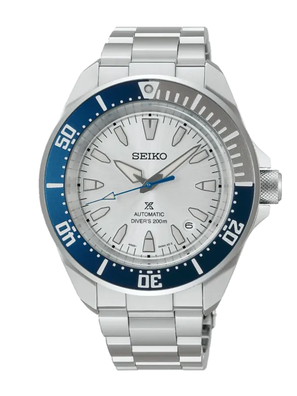 Vista frontal completa del reloj con bisel azul y esfera blanca, fondo blanco neutro.