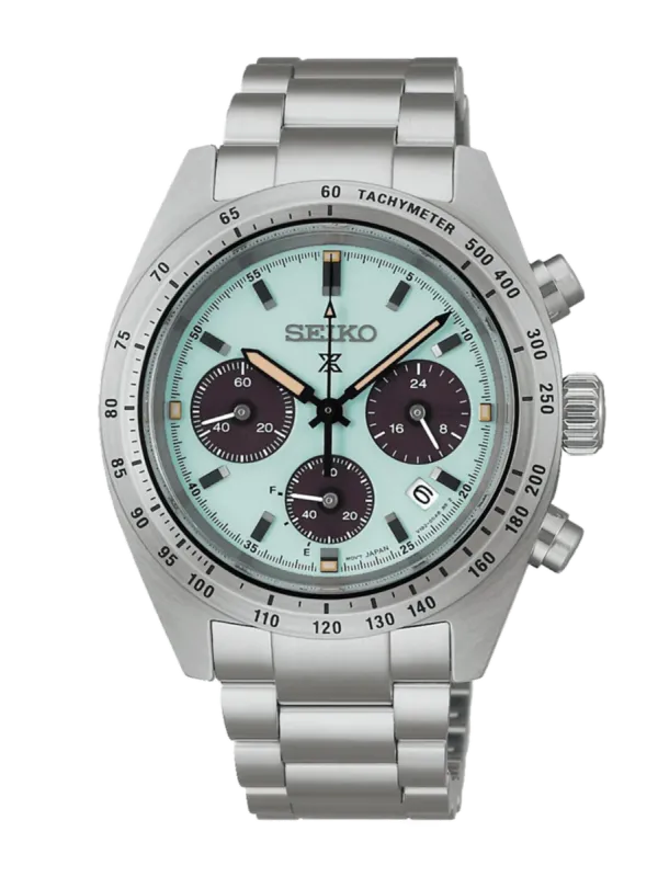 Vista frontal completa del reloj sobre fondo blanco, destacando la esfera verde menta y el brazalete de acero.