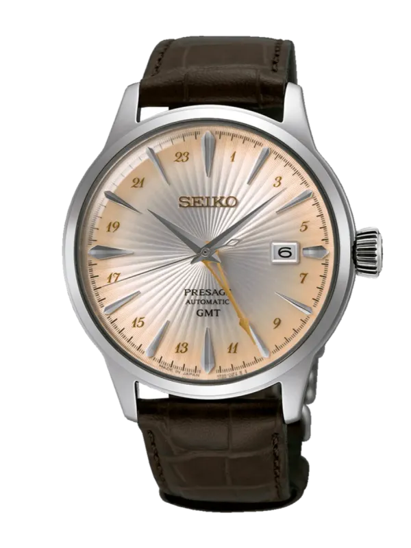 Vista frontal completa del reloj sobre fondo blanco, con correa de piel marrón y esfera de tono champagne