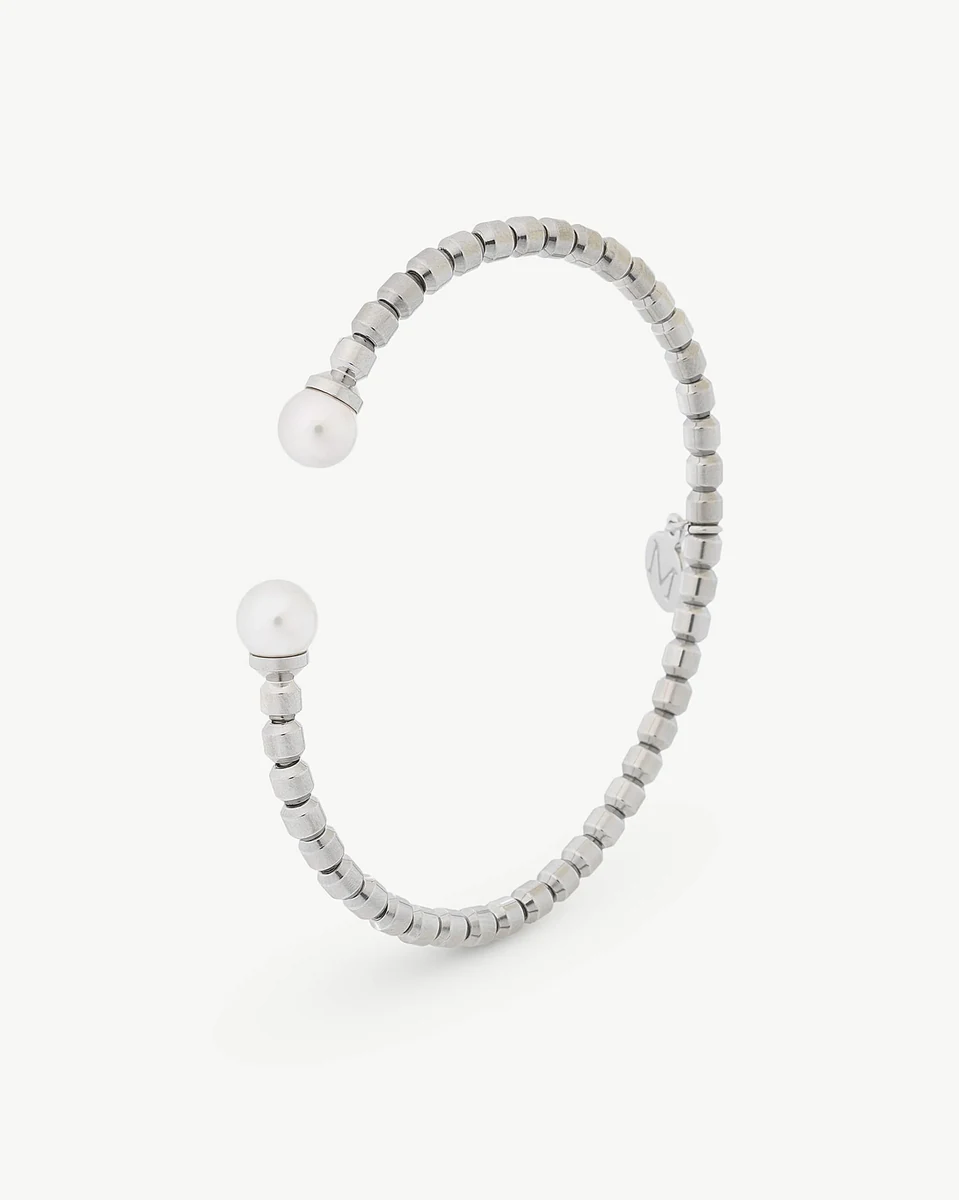 Steel bangle with white pearls, side angle view on a white background.