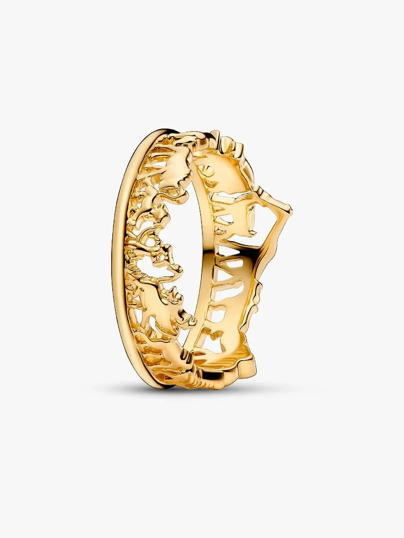 Gold ring with character reliefs shown from a side angle, white background.