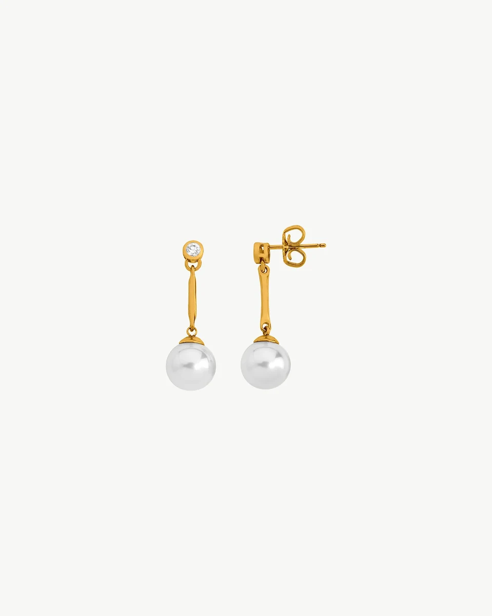 Front view of long pearl and cubic zirconia drop earrings on a pure white background.