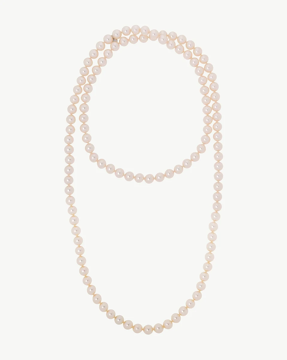 Pearl necklace arranged in a loop shape on a white background, full frontal view.