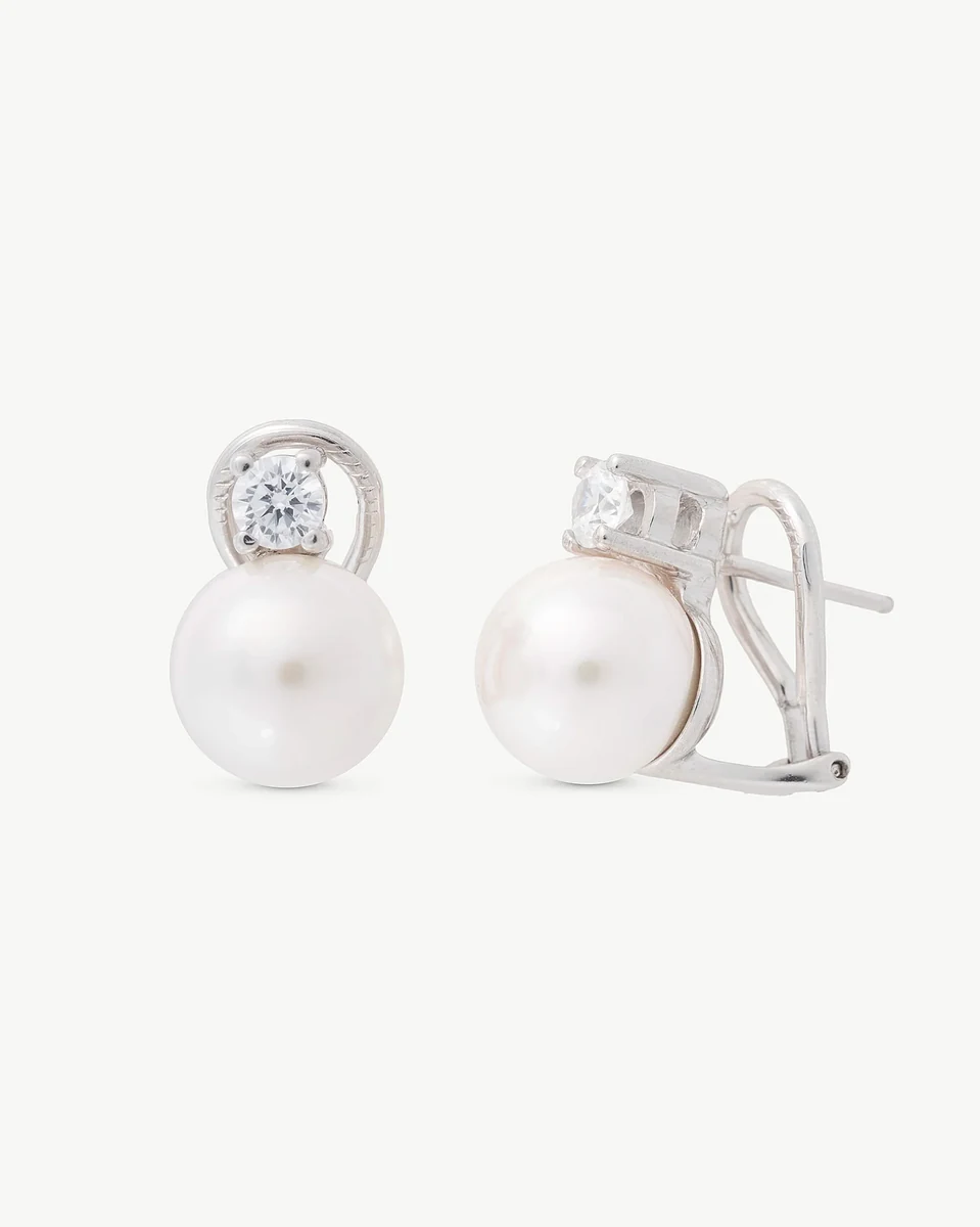 Pair of pearl and cubic zirconia earrings on white background, front and side view showing omega closure.