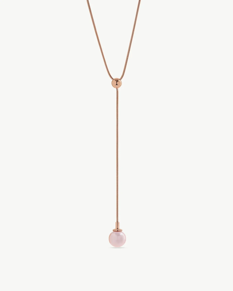Long necklace with pink pearl pendant, full front view on a neutral white background.