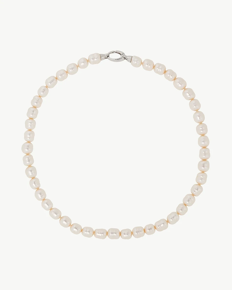 Baroque pearl necklace arranged in a circle on a white background, full front view.
