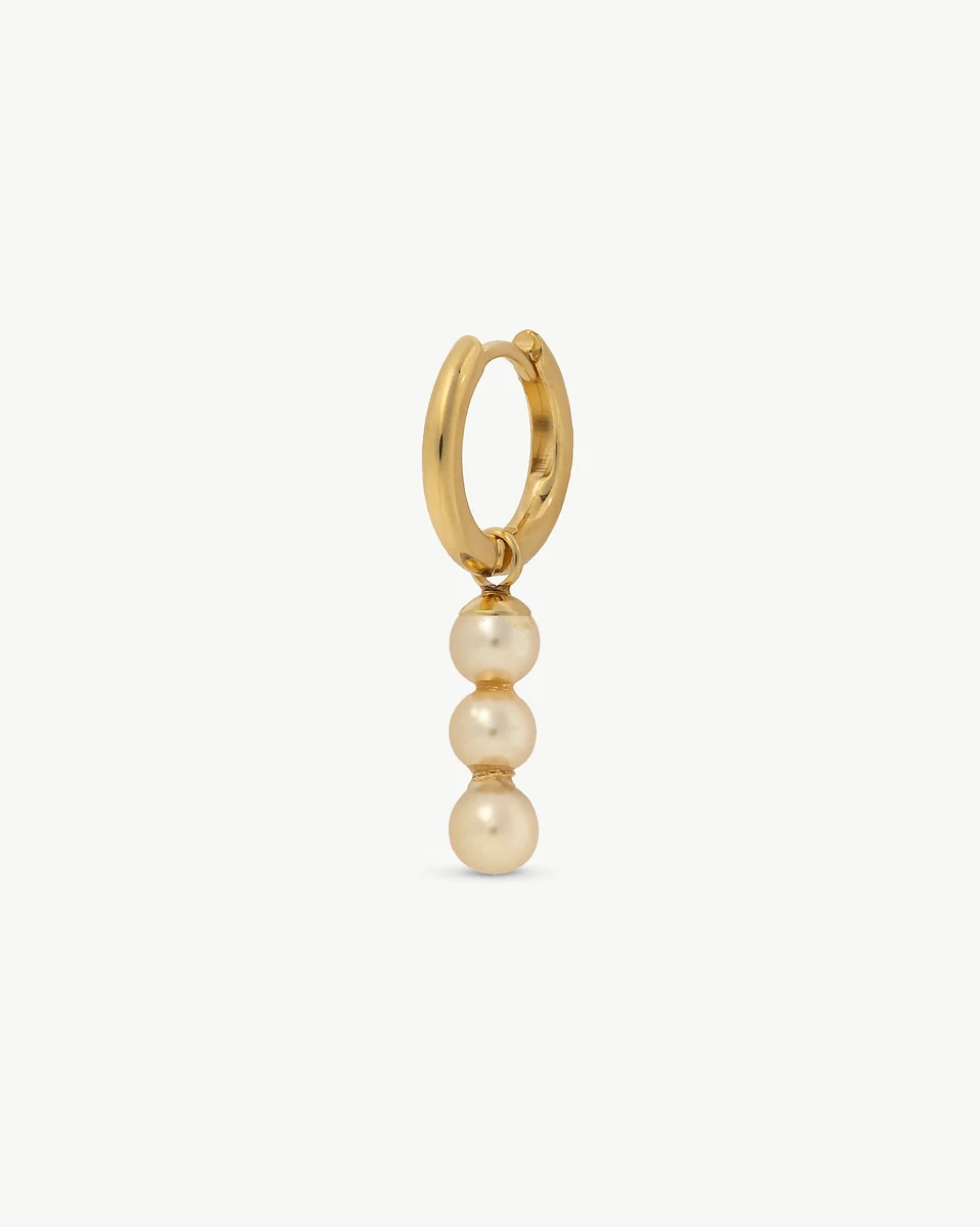 Gold hoop earring with three vertical pearls, front view on a white background.