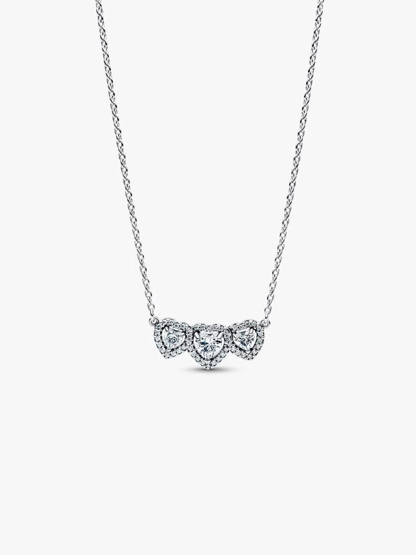 Silver necklace with three heart-shaped halo pendants, front view on a white background.