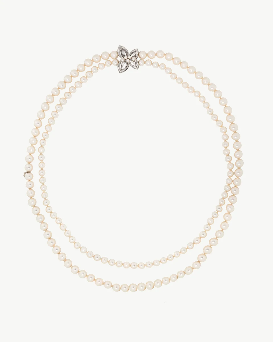 Double-strand white pearl necklace with cubic zirconia clasp, front view on a white background.