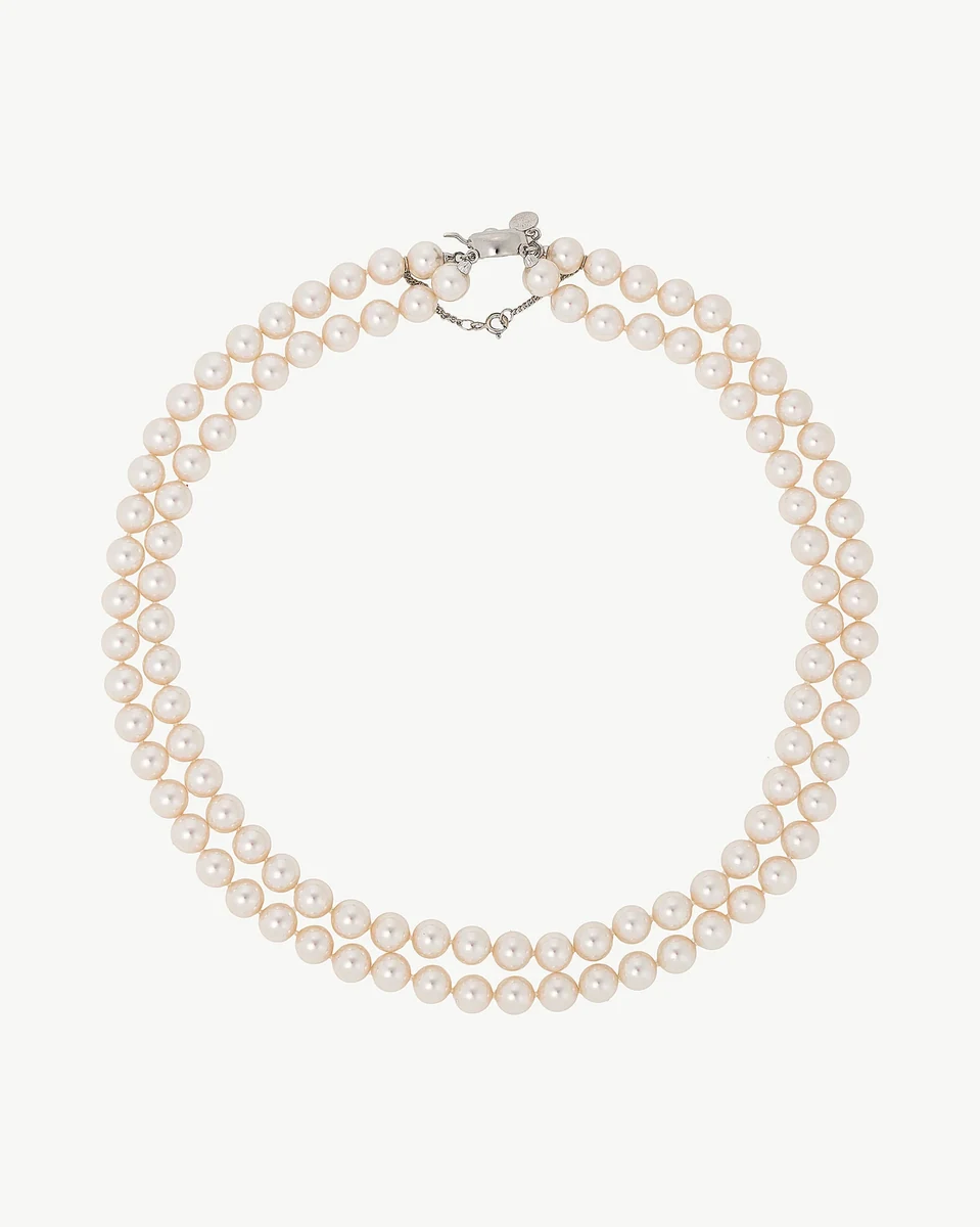 Double-strand white pearl necklace on a white background, front view showing silver clasp.