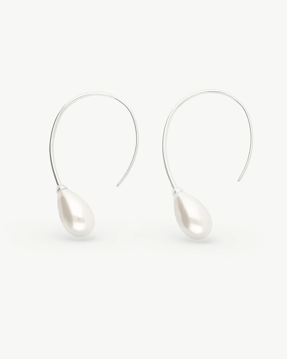 Front view of long pear-shaped pearl drop earrings on a solid white background.