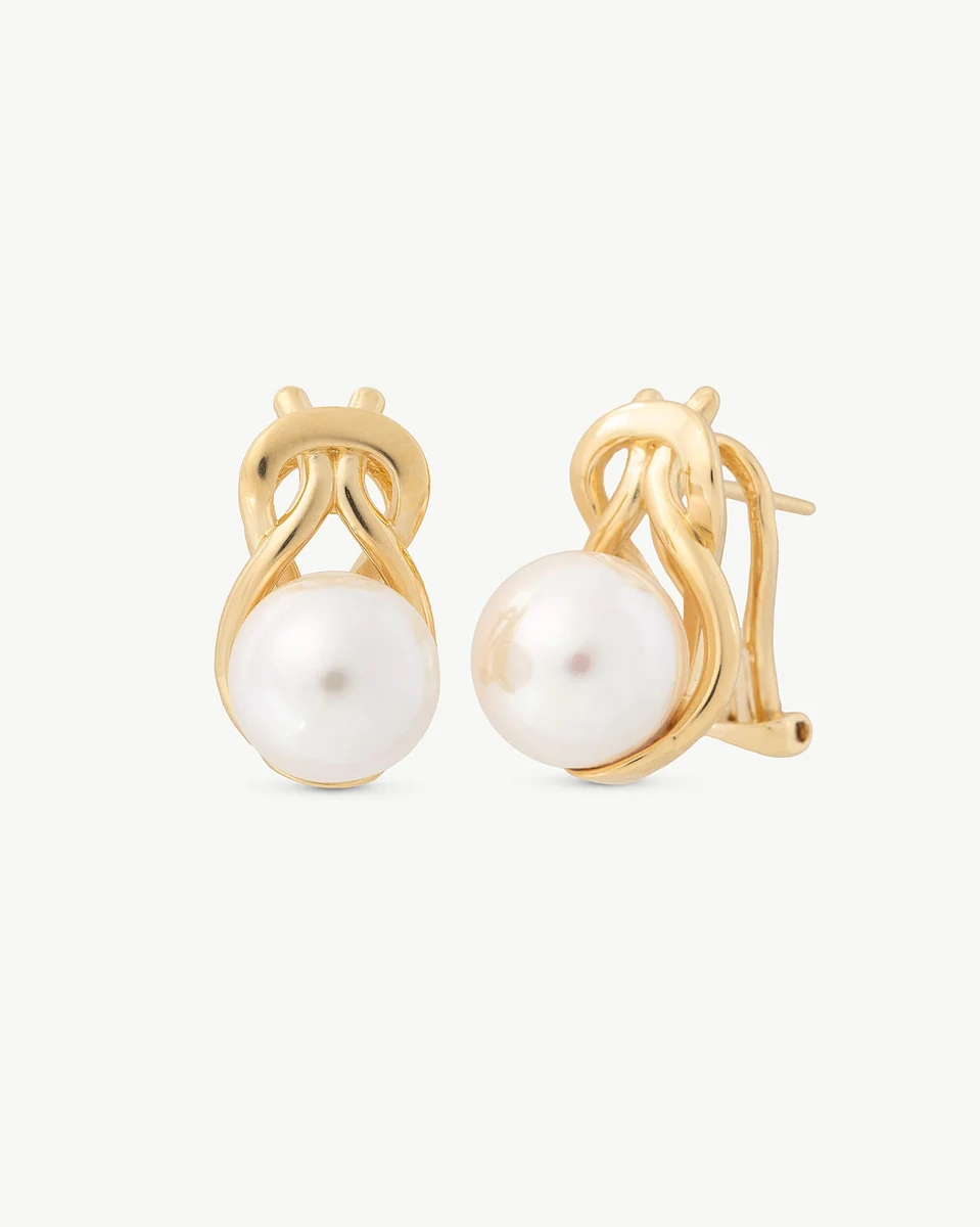 Front view of pearl earrings on a white background, showcasing the gold design and round pearl.