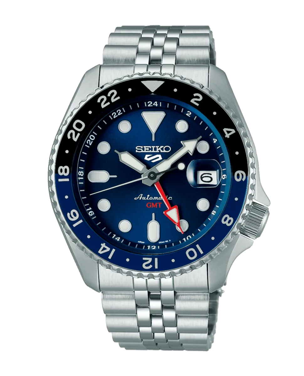 Vista frontal completa del reloj con esfera azul y brazalete de acero sobre fondo blanco
