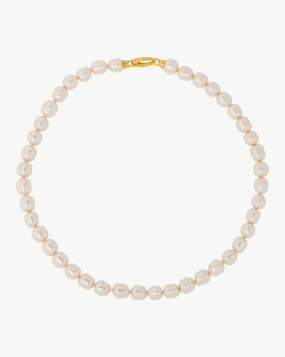 Baroque pearl necklace arranged in a circle on a white background, front view with gold clasp visible.