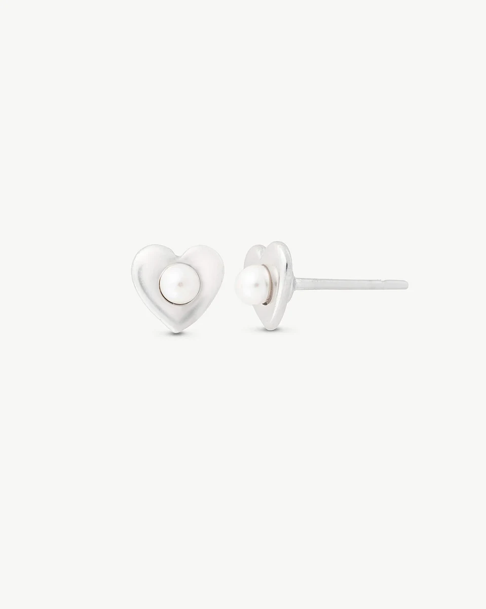 Front view of heart pearl stud earrings on a white background, showing the post profile.