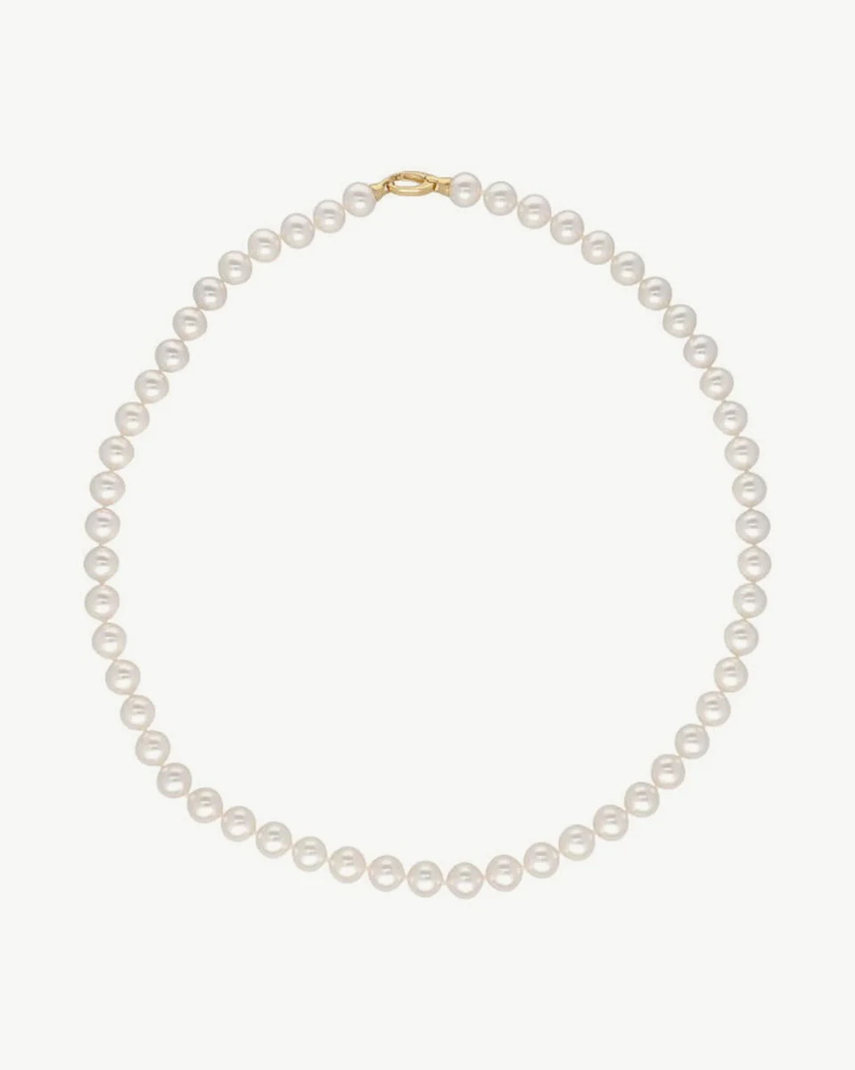 Pearl necklace arranged in a circular shape on a white background, full frontal view.
