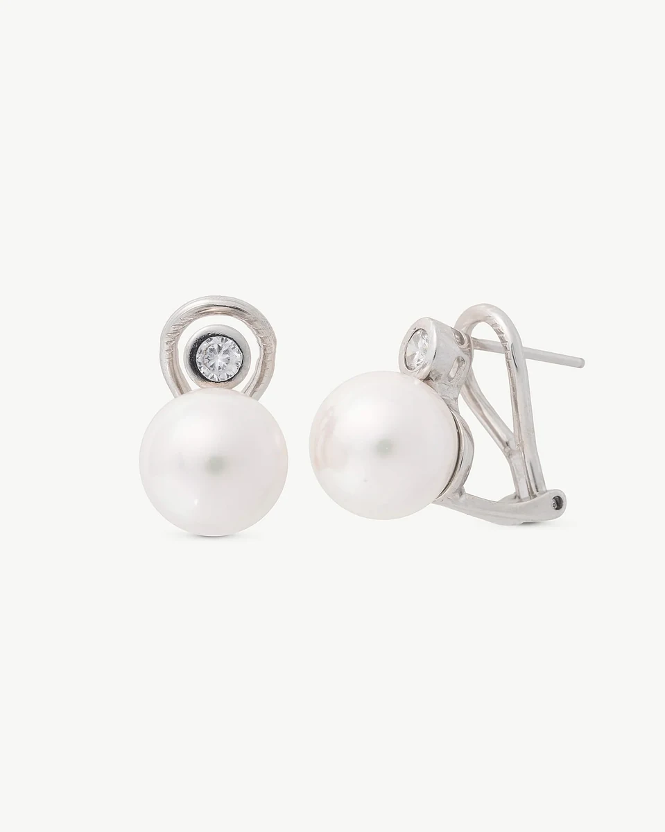 Pair of pearl and cubic zirconia earrings on white background, front and side view showing the omega closure.