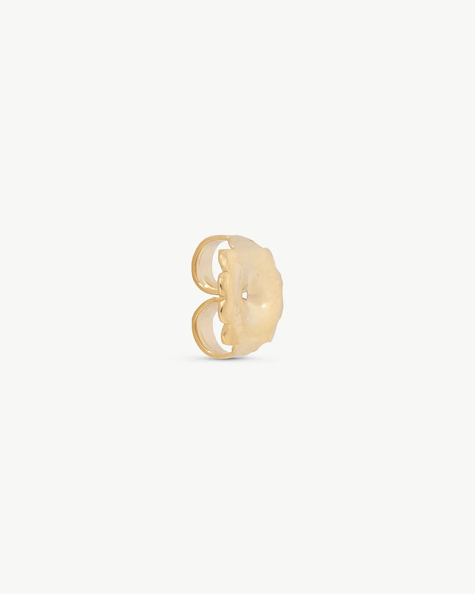 Gold earring back viewed from a side profile, on a neutral white background.