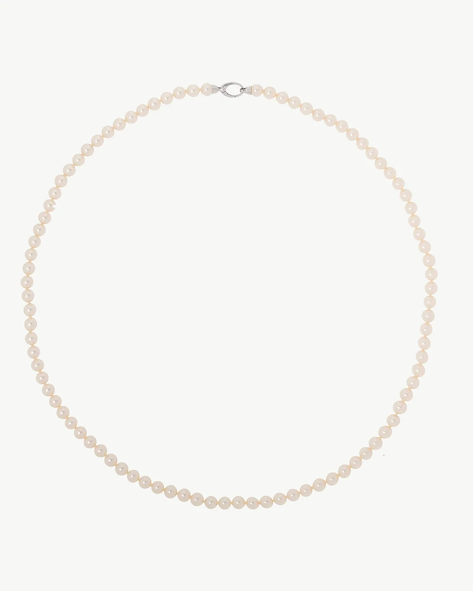 Pearl necklace arranged in a circular shape on a white background, full frontal view.