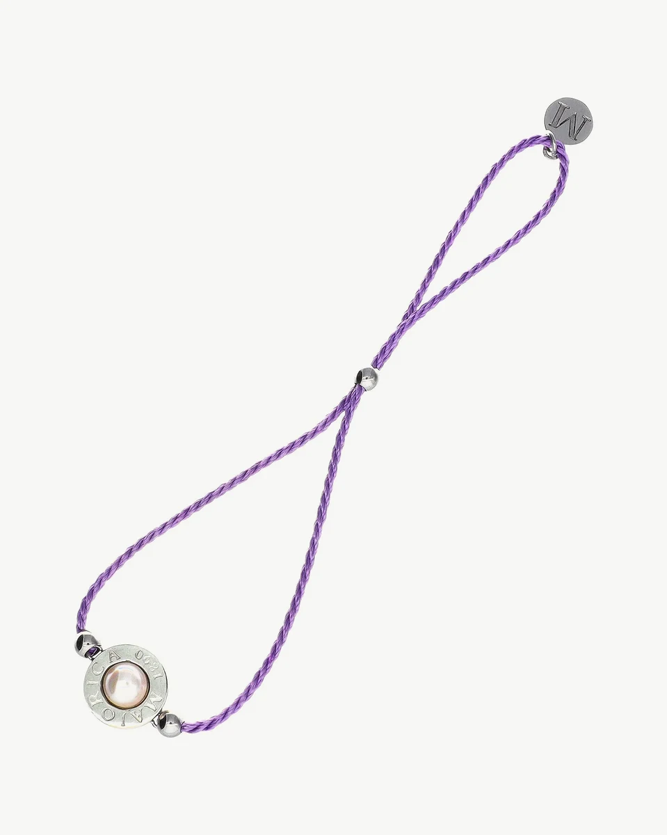 Braided lilac bracelet with half-sphere pearl and metal clasp, front view on white background.