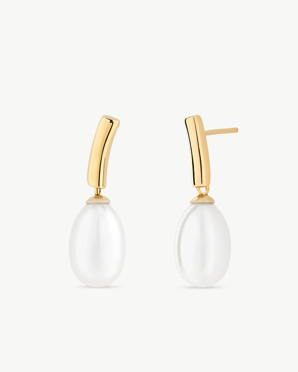 Front view of pearl earrings with gold-plated settings on a white background.