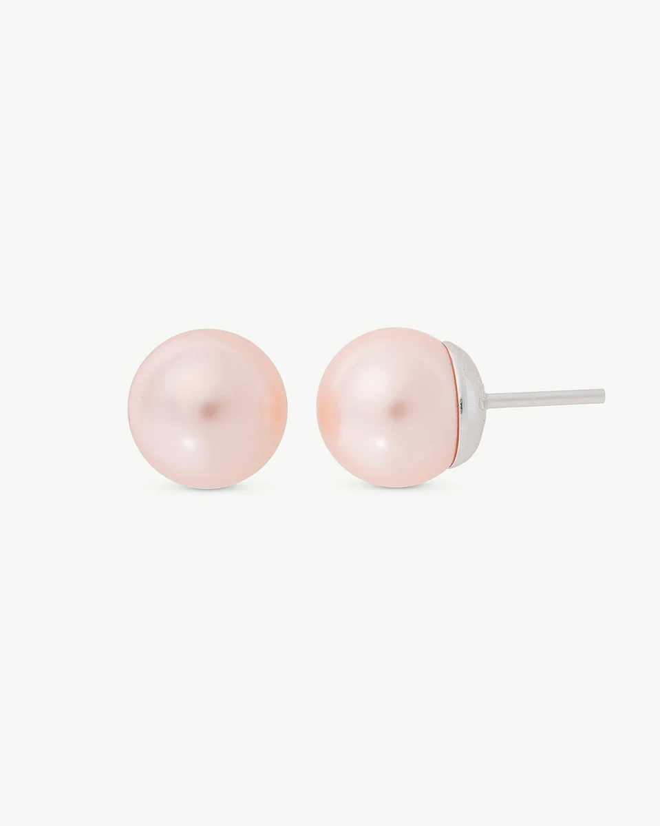 Front view of pink pearl stud earrings on a white background, showing the silver post from the side.