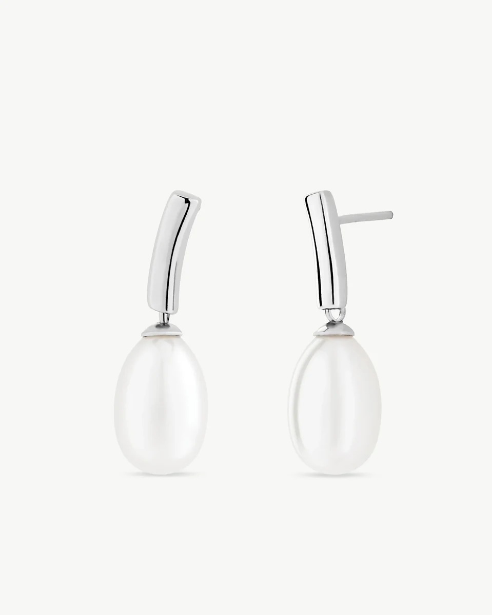 Pair of white pearl and silver earrings, front view on a pure white background.
