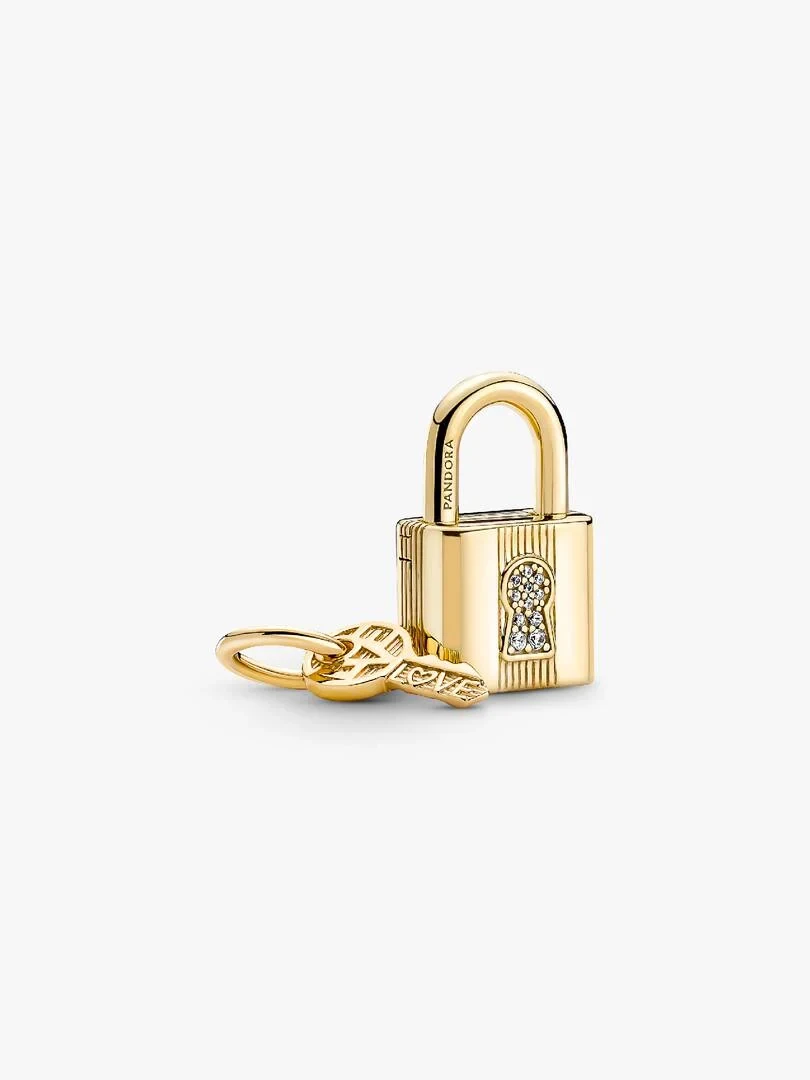 Side view of the gold-plated padlock and key charms on a white background.