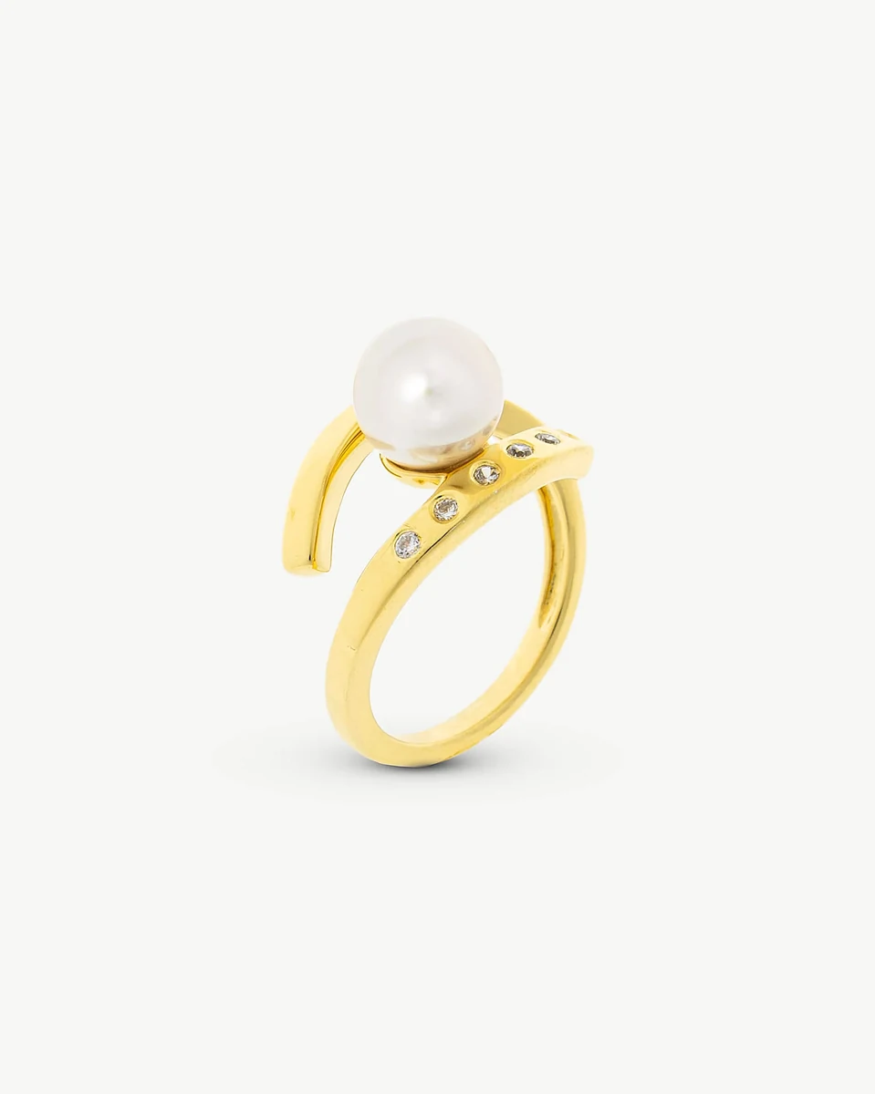 Ring with central pearl shown from a high angle on a pure white background.