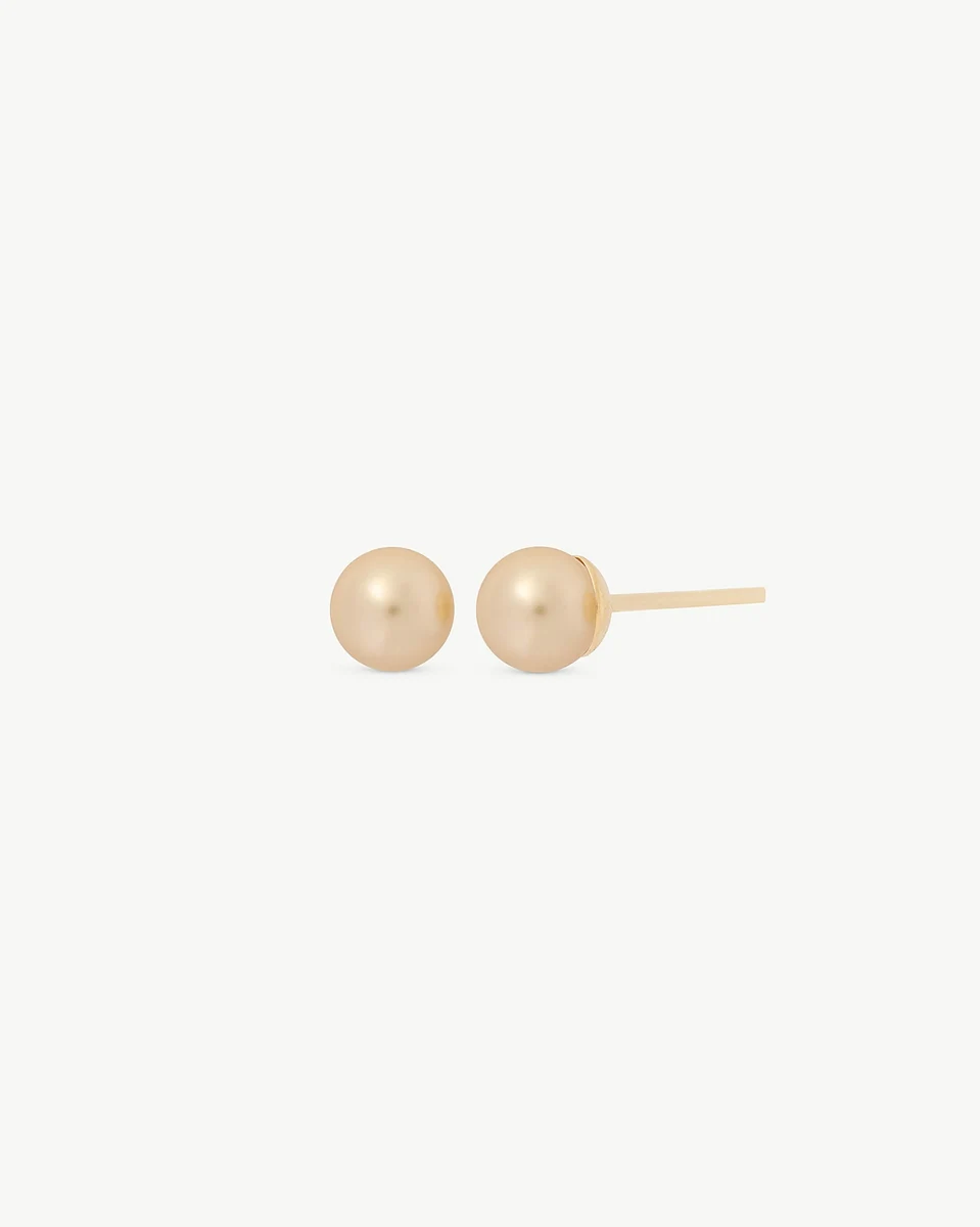 Front view of pearl stud earrings on a white background, showing the side profile of the post.