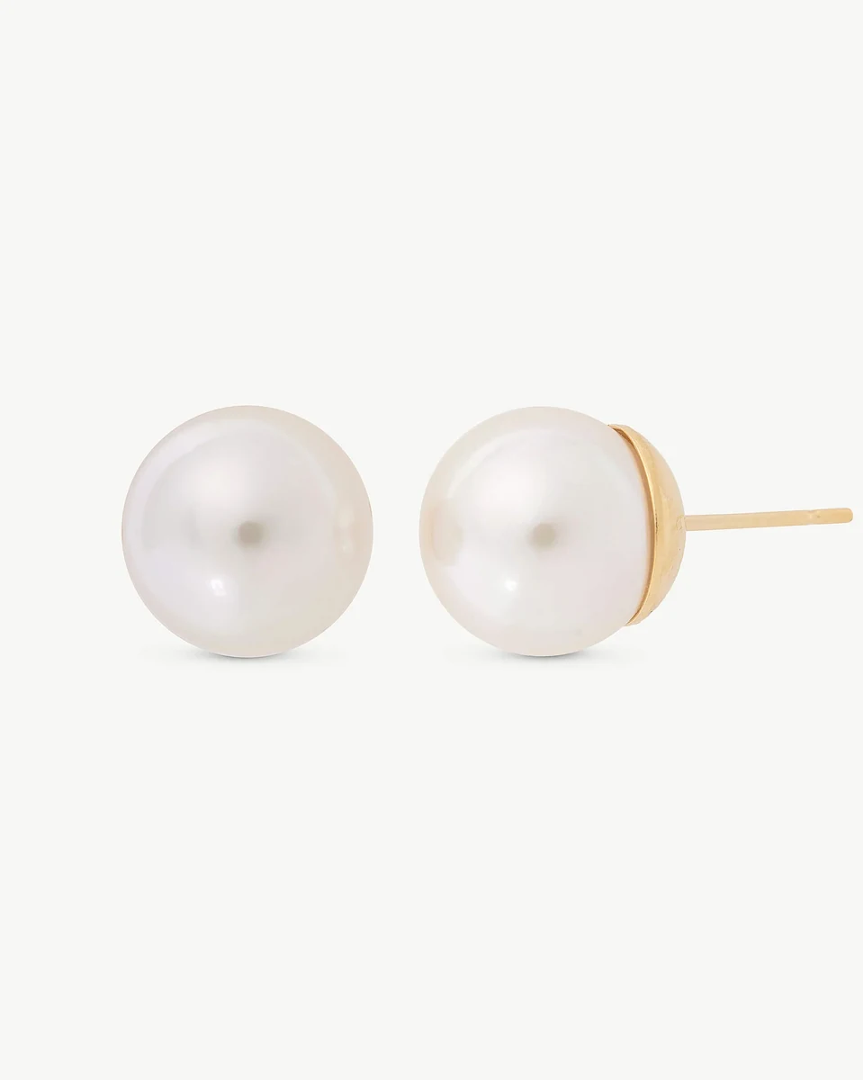 Front and side view of pearl stud earrings on a white background, showing the gold post.