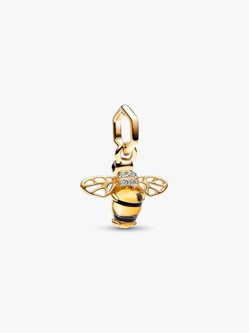 Bee charm with yellow body and gold wings, front view on white background.