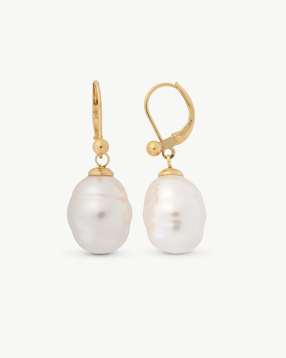 Front view of baroque white pearl earrings with gold leverback closures on a white background.