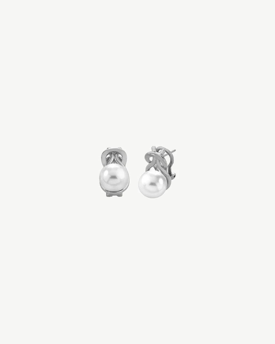 Front view of pearl stud earrings on a white background, showing the silver setting detail.