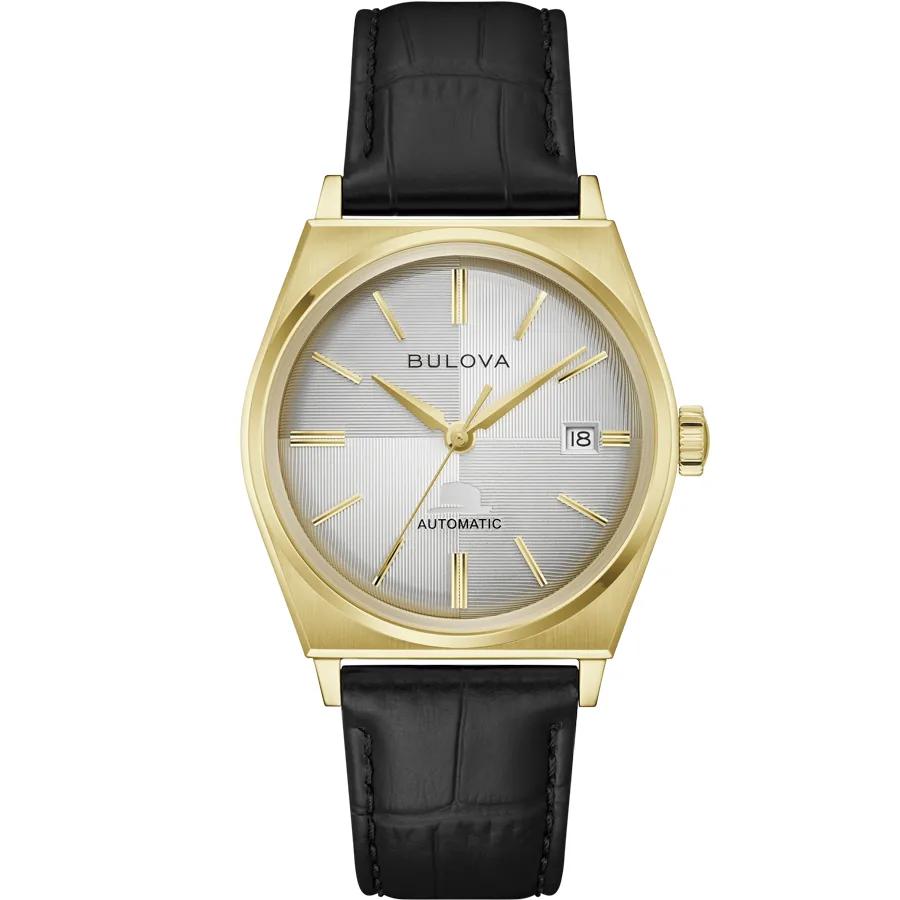 Vista frontal completa del reloj con caja dorada y correa de piel negra sobre fondo blanco.