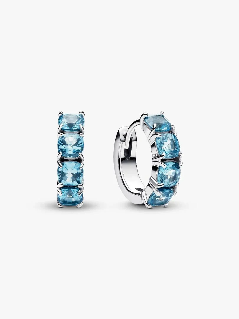 Pair of light blue crystal hoop earrings, front and side view on a white background.