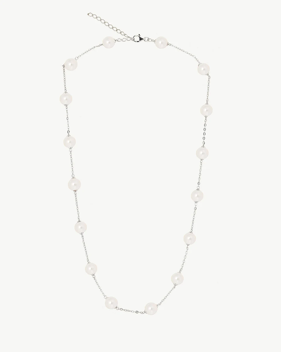 Full front view of pearl and chain necklace on white background, showing clasp detail.