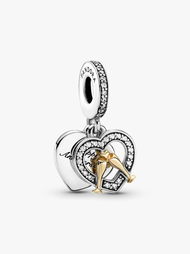 Two-tone heart charm with champagne glasses, front view on a white background.