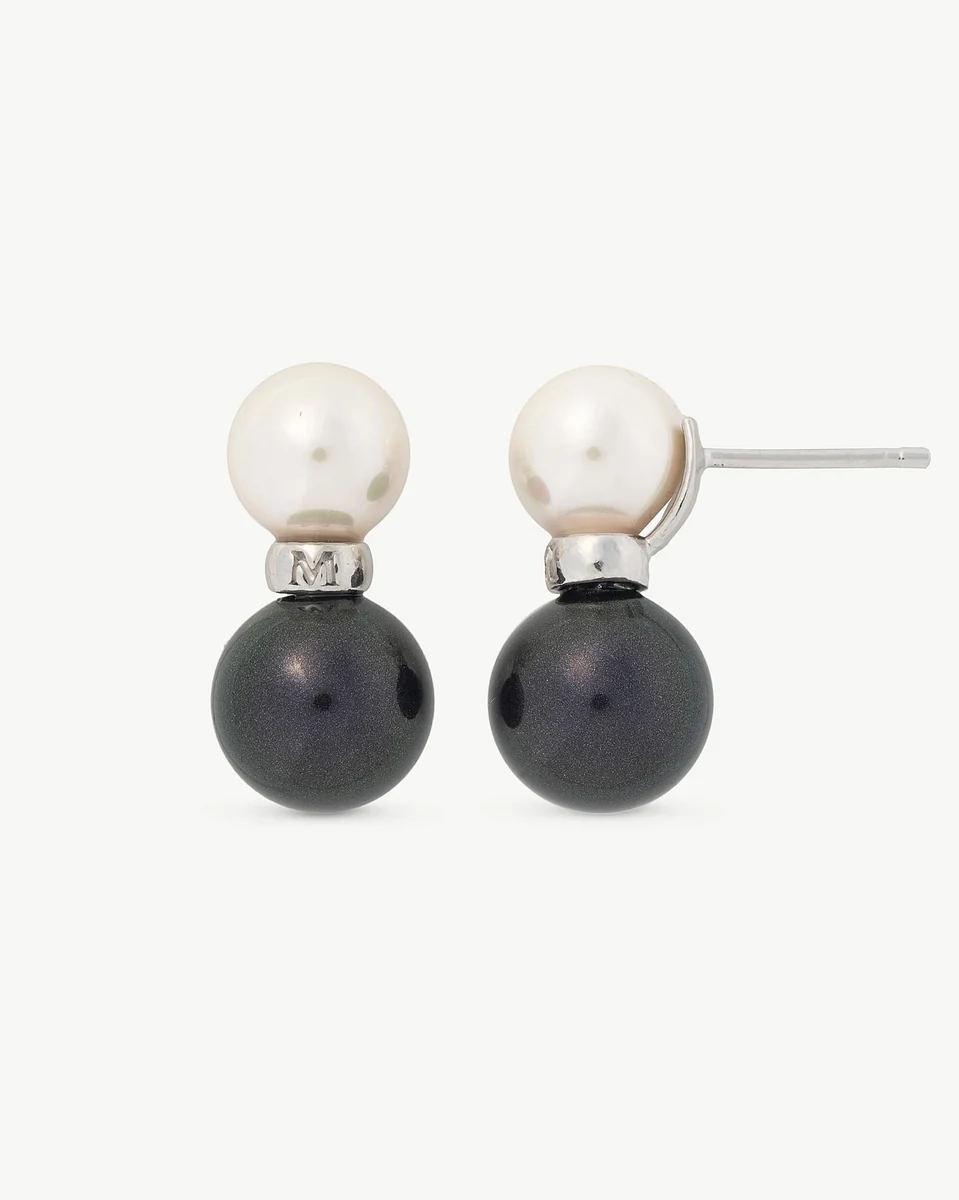 Front view of the white and black pearl earrings on a pure white background.