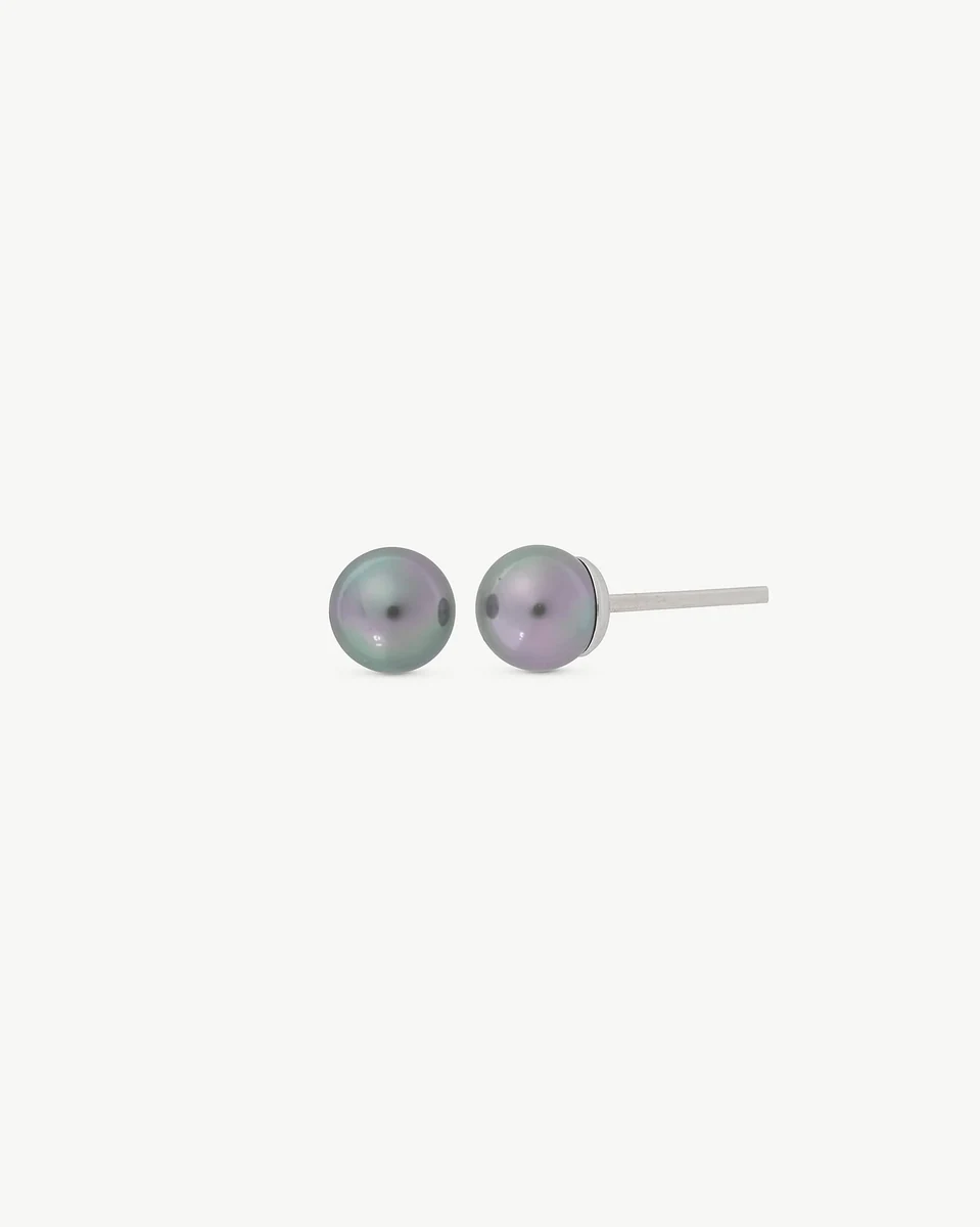 Side view of grey pearl stud earrings on a white background, showing the silver post.