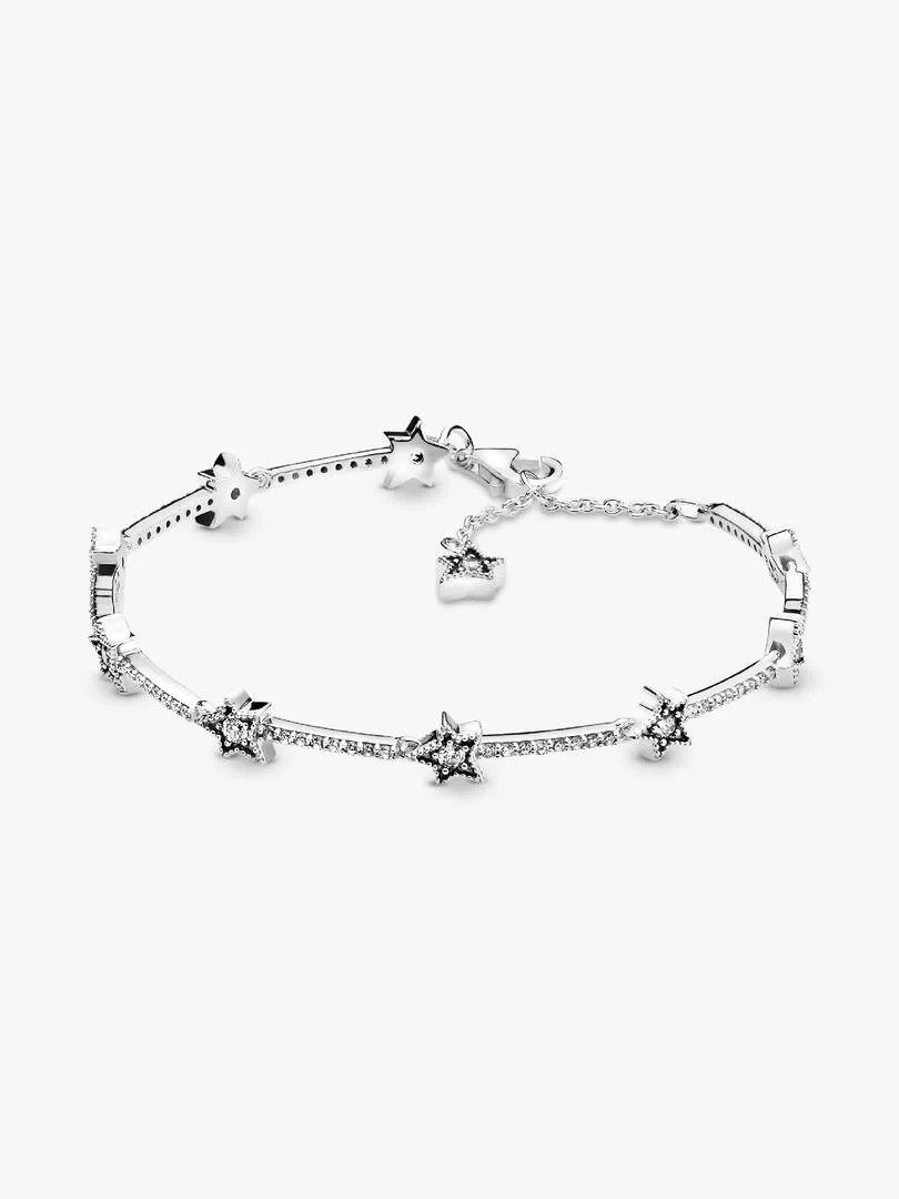 Silver bangle bracelet with star motifs, angled front view on a pure white background.