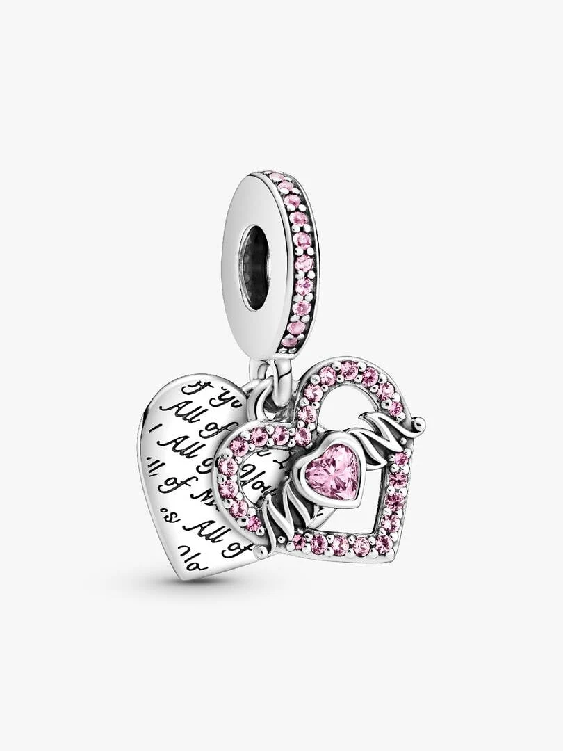 Side view of double heart silver charm with pink crystals on a white background.