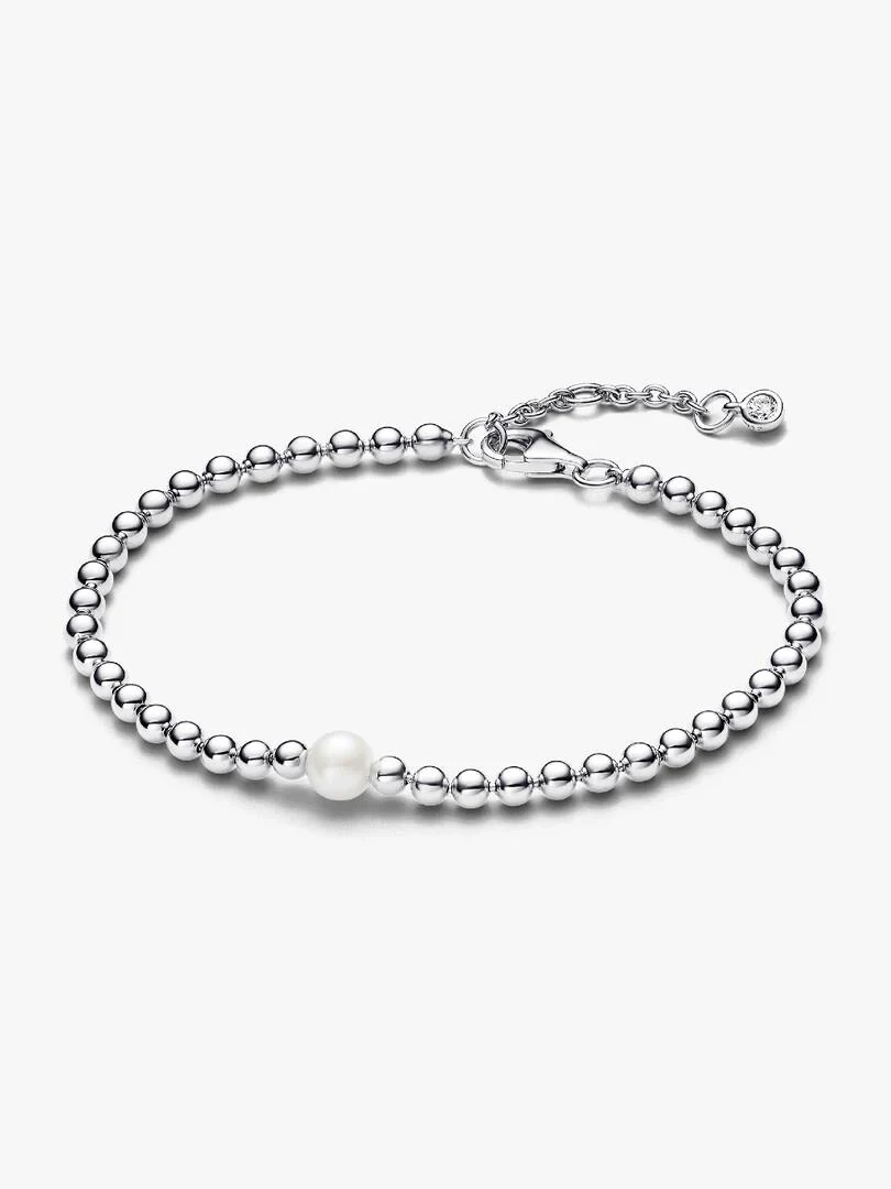 Silver bead bracelet with a central pearl, front view on a pure white background.