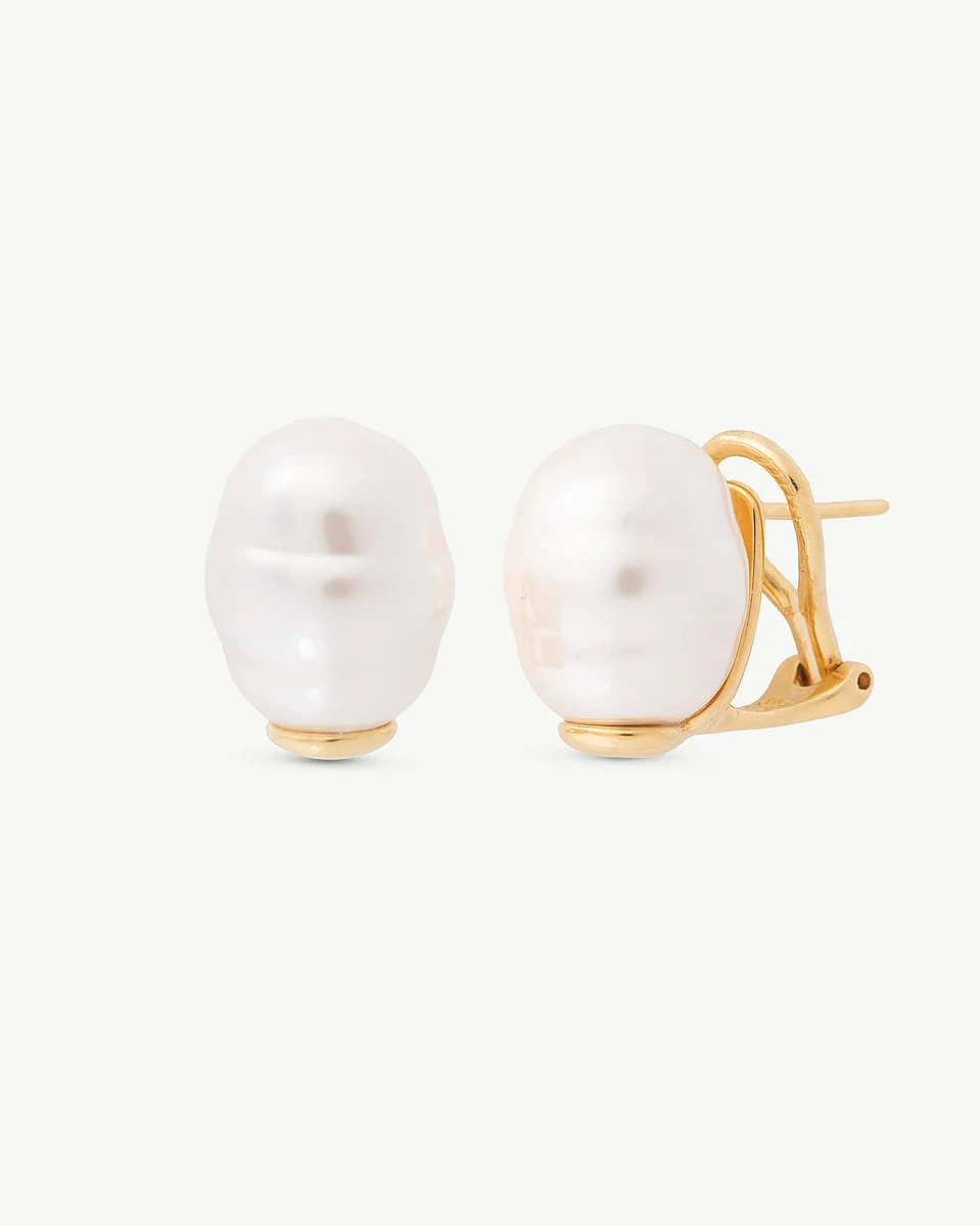 Pair of baroque pearl earrings on white background, front and side view showing gold omega closure.