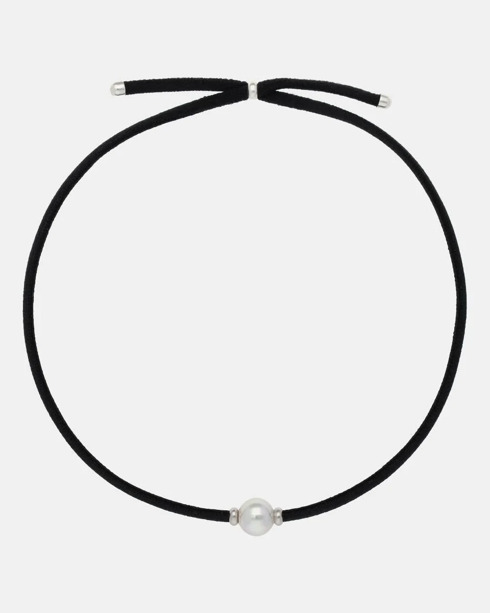 Black necklace with central white pearl, full front view on a neutral white background.