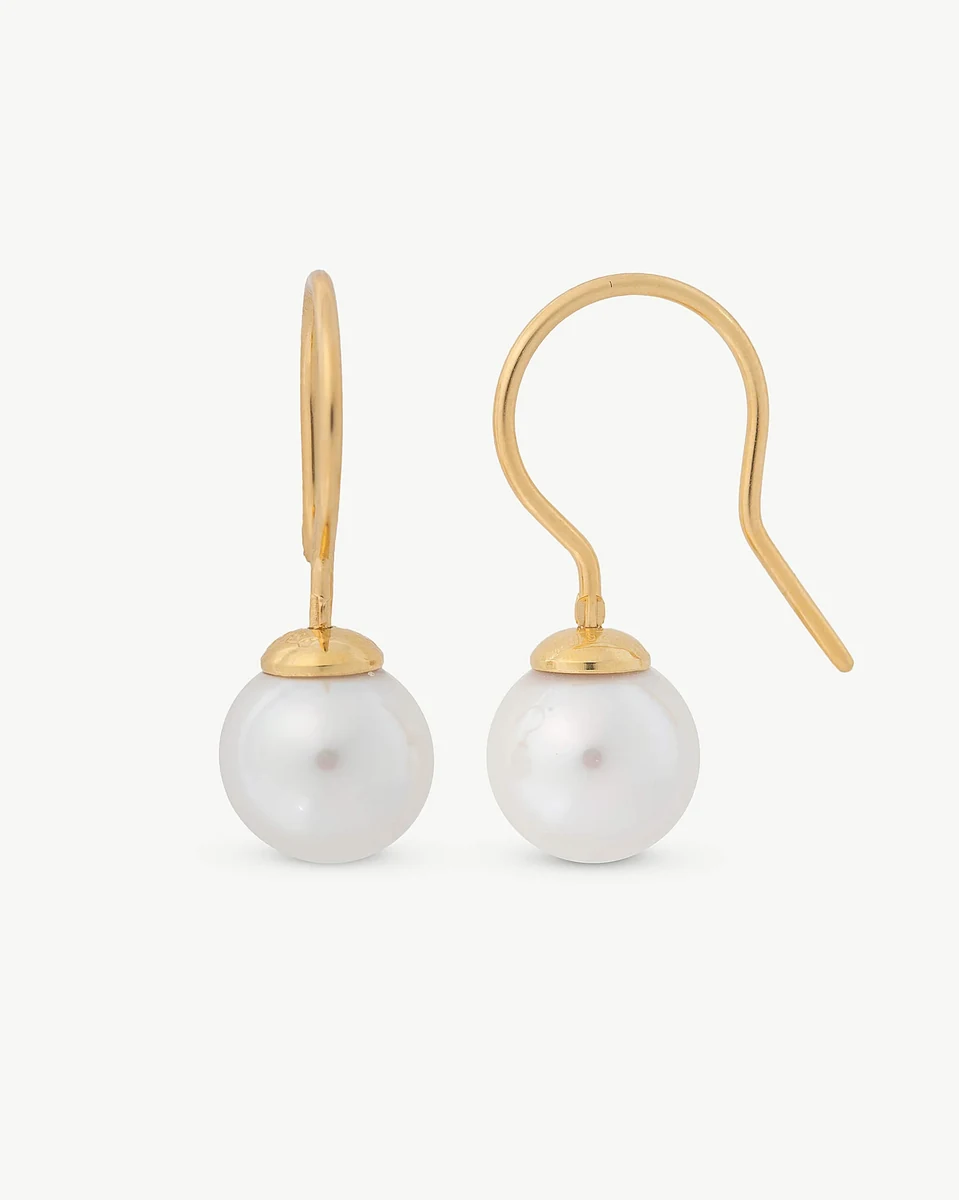 Front view of pearl earrings with gold hook closures on a white background.
