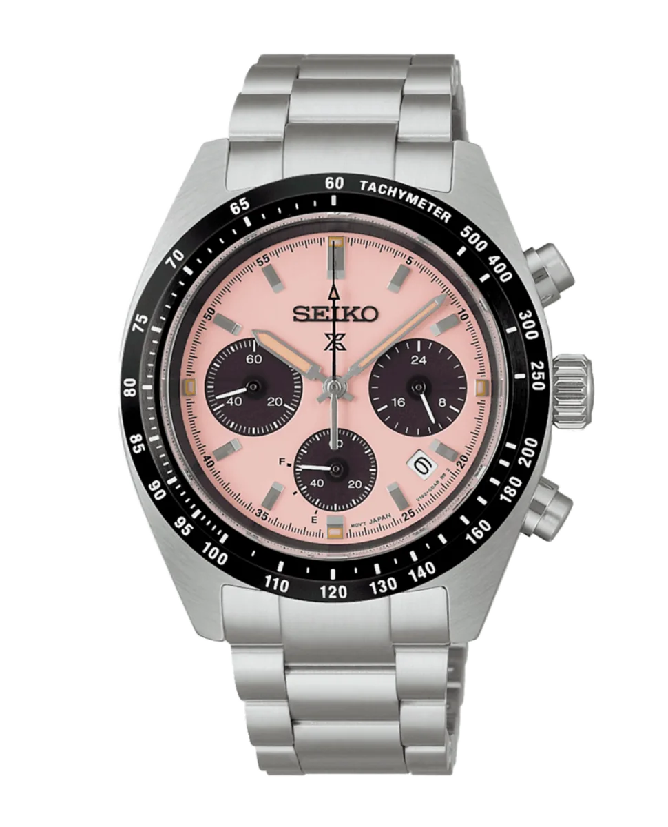 Vista frontal completa del reloj con esfera rosa y brazalete de acero, fondo blanco.