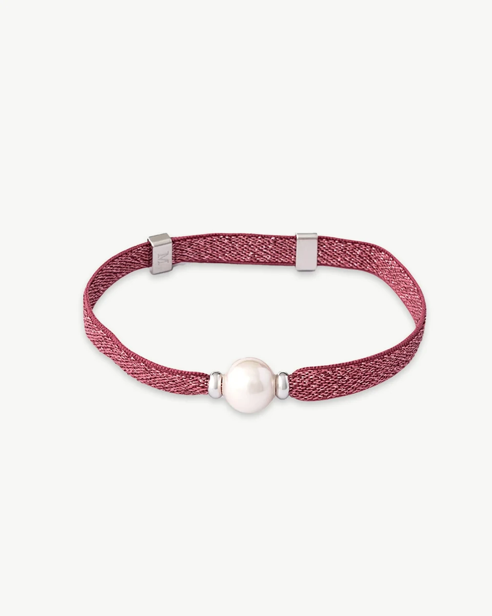 Magenta thread bracelet with a central white pearl, front view on a white background.