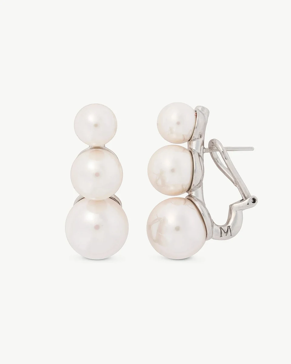 Front and side view of the triple pearl earrings on a white background, showing the omega closure.