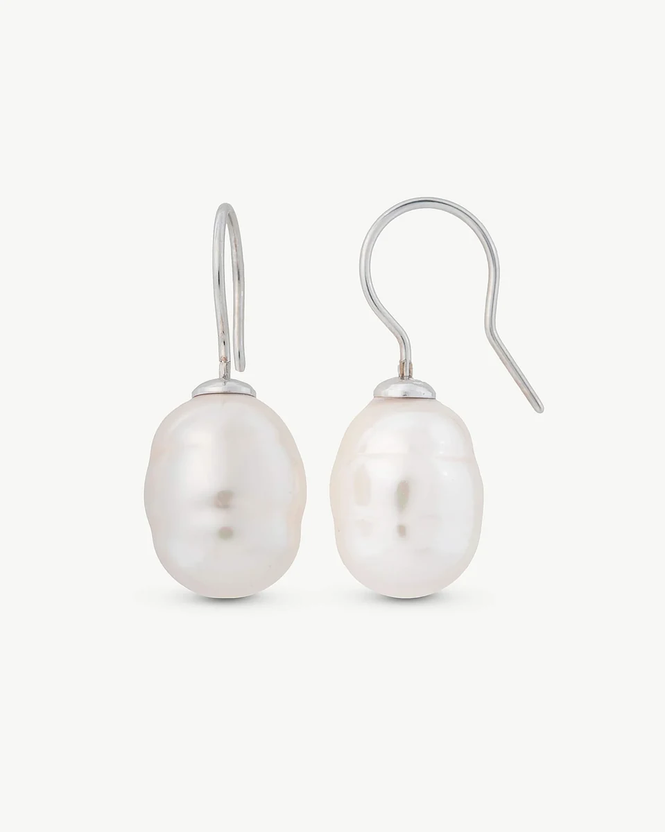 Pair of baroque pearl drop earrings with hook closures, front view on white background.